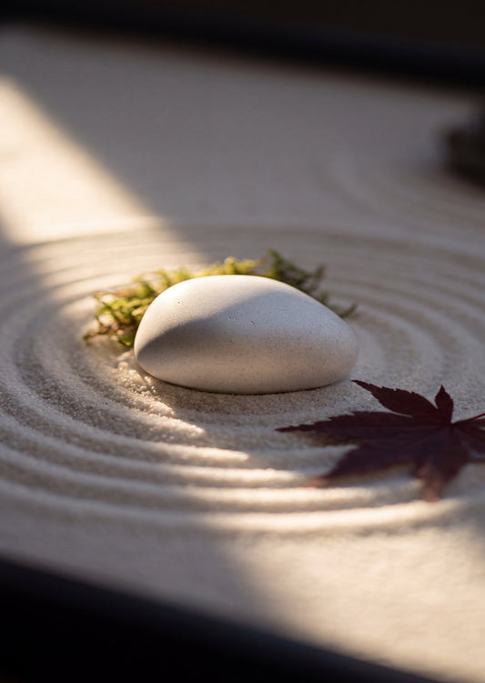 Handcrafted memorial memory stone incorporating cremation ashes into a smooth stone keepsake, designed as a beautiful way to preserve remaining ashes at home.